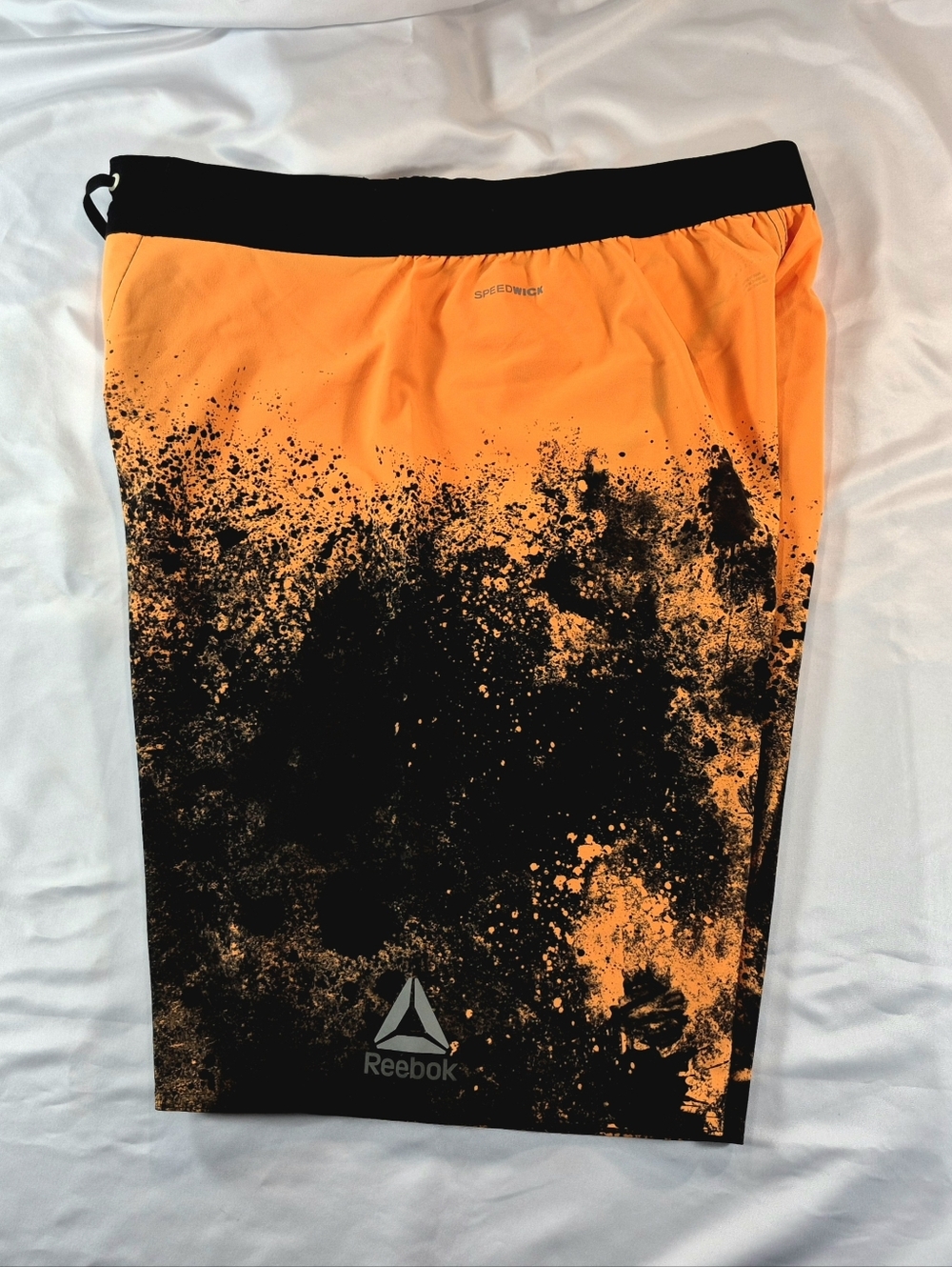 NWOT Reebok Speedwick Splatter Print Training Workout Shorts Orange Black Swim